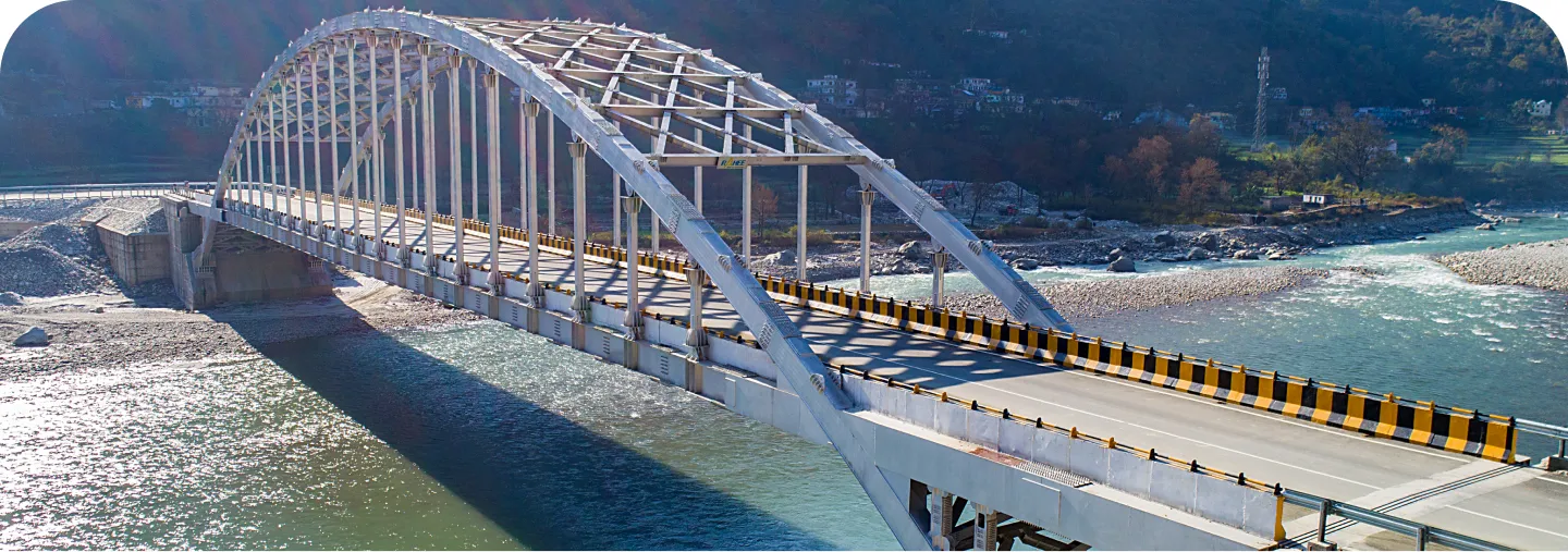 Steel arch bridge over a river constructed by Rahee